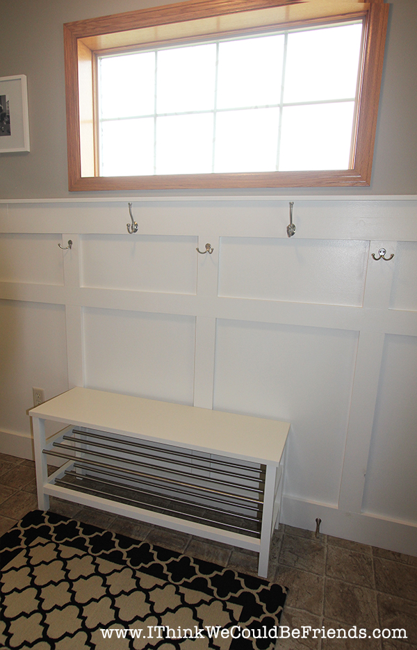 Functional Entryway Makeover with board and batten and dark contrasting doors.