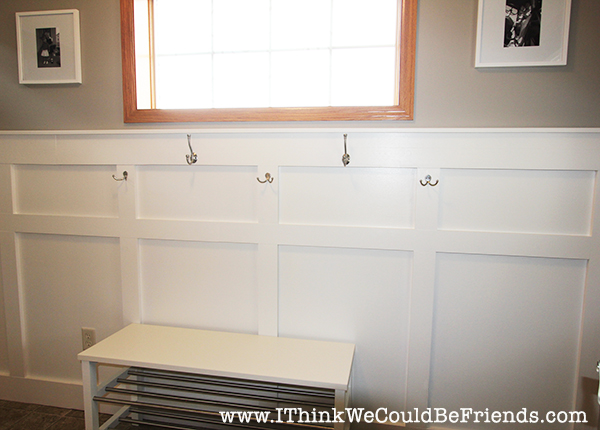 Functional Entryway Makeover with board and batten and dark contrasting doors.