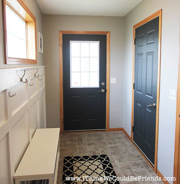 Functional Entryway Makeover with board and batten and dark contrasting doors.