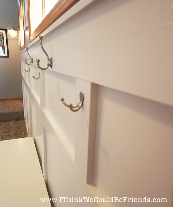 Functional Entryway Makeover with board and batten and dark contrasting doors.