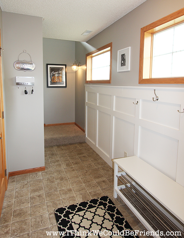 Functional Entryway Makeover with board and batten and dark contrasting doors.