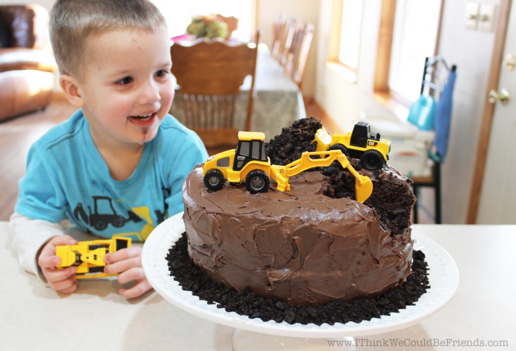 This Construction Themed Birthday Cake is perfect for the heavy equipment operator in your life! (Or 3-yr old obsessed with loaders and back hoes!) This cake is super easy to make but will be a huge hit at the party!