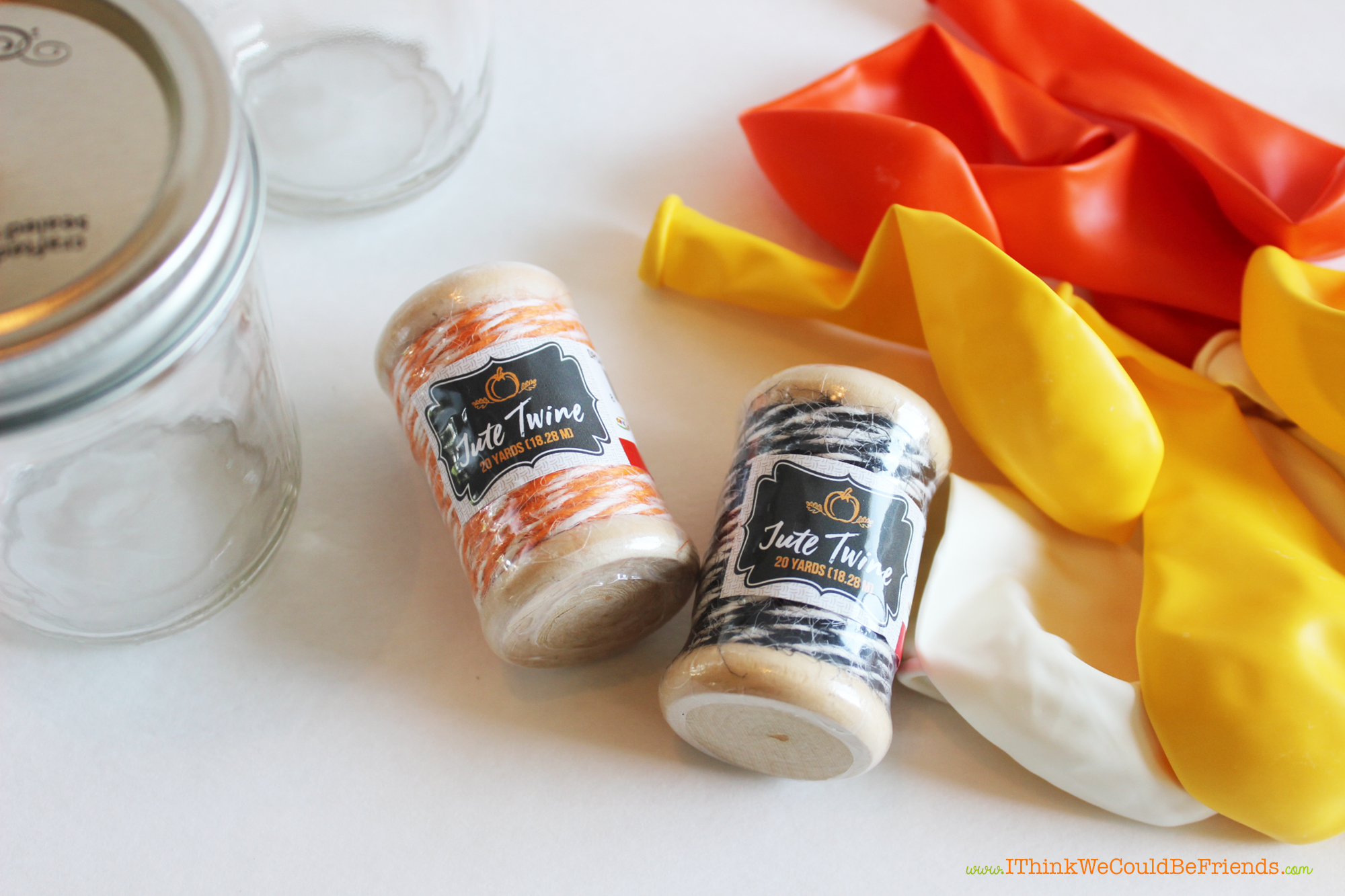 Fun & Easy Halloween craft, these Halloween mason treat jars come together quickly with cut up balloons! Plus, free Halloween mason jar toppers printable!