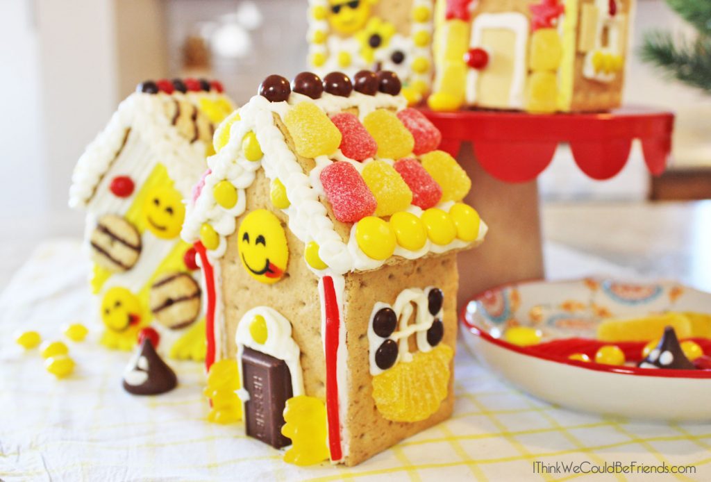 Looking for a fun Emoji Birthday Party idea? Our kids LOVED these Emoji Gingerbread Houses! They are just made from graham crackers and are EASY to make! Also includes a free printable bag topper to make your own Emoji Gingerbread House Build & Decorate kits! #Emoji #Birthday #Party #Ideas #Gingerbread #House #Decorations #Christmas 