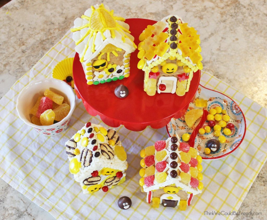 Looking for a fun Emoji Birthday Party idea? Our kids LOVED these Emoji Gingerbread Houses! They are just made from graham crackers and are EASY to make! Also includes a free printable bag topper to make your own Emoji Gingerbread House Build & Decorate kits! #Emoji #Birthday #Party #Ideas #Gingerbread #House #Decorations #Christmas 