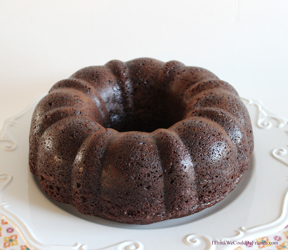 Awesome and EASY Chocolate Sour Cream Bundt Cake Recipe starts from a box cake mix but then you add sour cream and pudding and it is incredibly MOIST!!!! Mixes up in 5 minutes but tastes like it is from a fancy bakery! Your guests will RAVE!! #chocolate #bundt #cake #recipe #easy #awesome #moist #mix #frombox