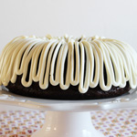 Awesome and EASY Chocolate Sour Cream Bundt Cake Recipe starts from a box cake mix but then you add sour cream and pudding and it is incredibly MOIST!!!! Mixes up in 5 minutes but tastes like it is from a fancy bakery! Your guests will RAVE!! #chocolate #bundt #cake #recipe #easy #awesome #moist #mix #frombox