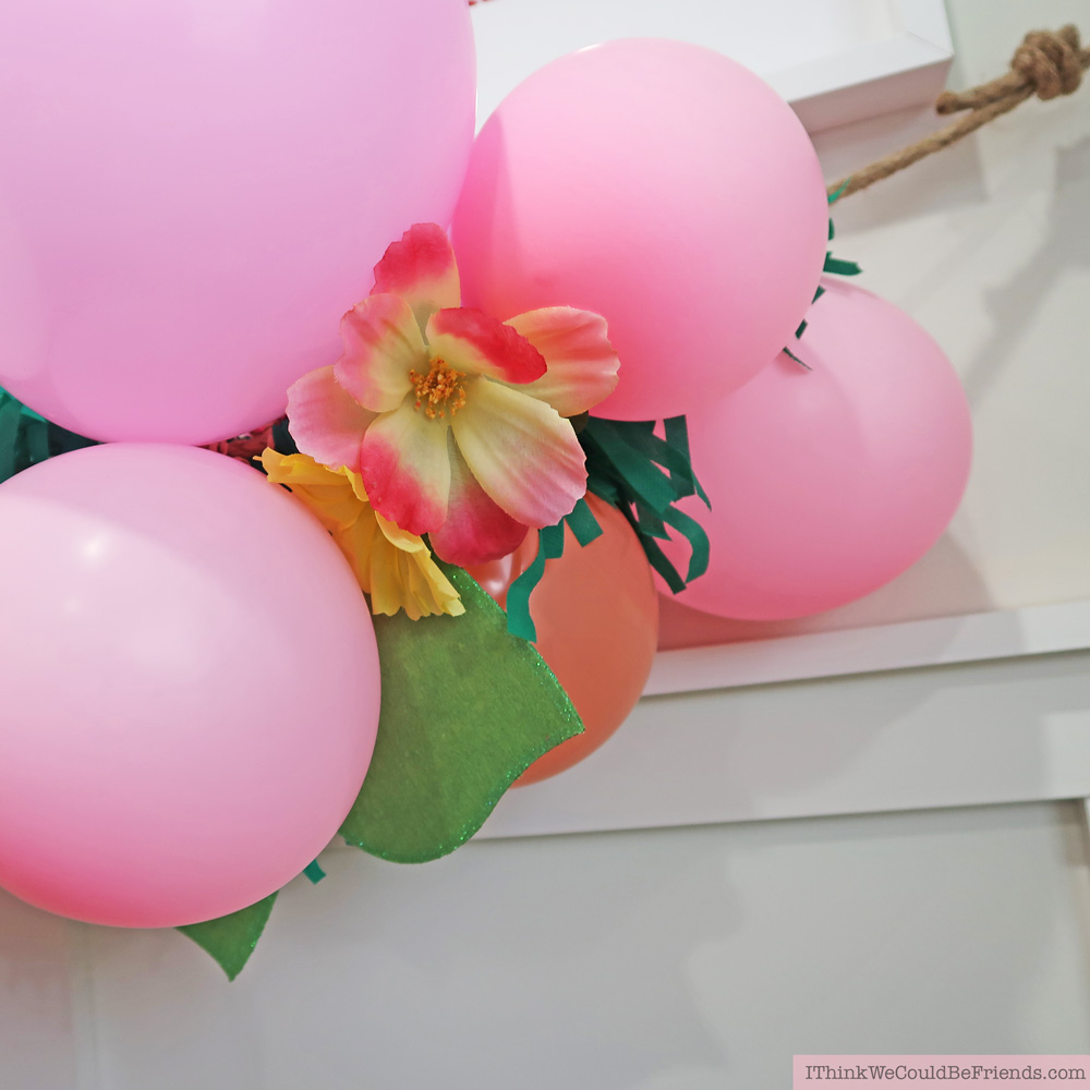 DIY Tropical Balloon Garland! Cheap but TASTEFUL Flamingo Party Decoration Ideas, using ALL items from the Dollar Tree! We hosted a beautiful Flamingo Baby Shower for my sister that didn't break the bank!!! Everyone LOVED the flamingo theme and especially the DIY Tropical Balloon Garland, flamingo cupcake topper and a FREE printable! #flamingo #party #decoration #ideas #DIY #balloon #garland #free #printable #cheap #easy #baby #shower #bridal #kids