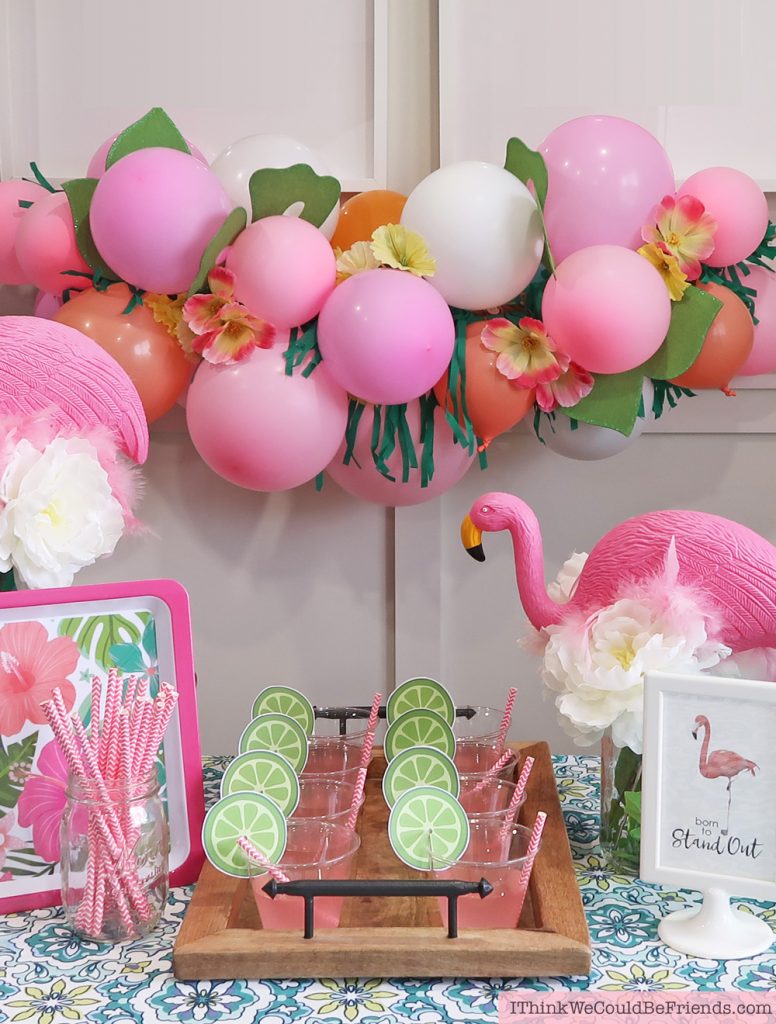 DIY Tropical Balloon Garland! Cheap but TASTEFUL Flamingo Party Decoration Ideas, using ALL items from the Dollar Tree! We hosted a beautiful Flamingo Baby Shower for my sister that didn't break the bank!!! Everyone LOVED the flamingo theme and especially the DIY Tropical Balloon Garland, flamingo cupcake topper and a FREE printable! #flamingo #party #decoration #ideas #DIY #balloon #garland #free #printable #cheap #easy #baby #shower #bridal #kids