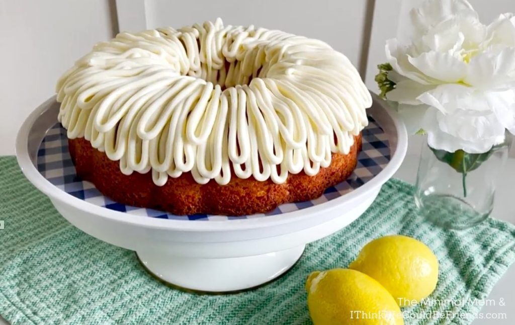 decorated lemon bundt cake on cake stand
