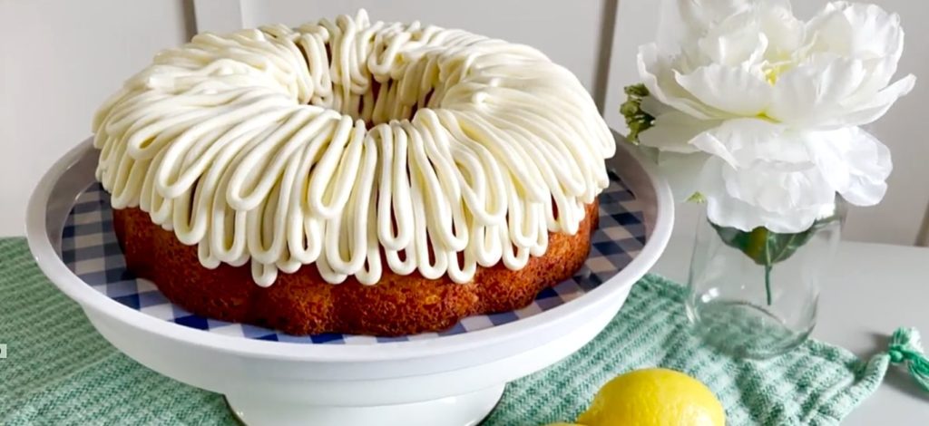 lemon bundt cake on cake stand